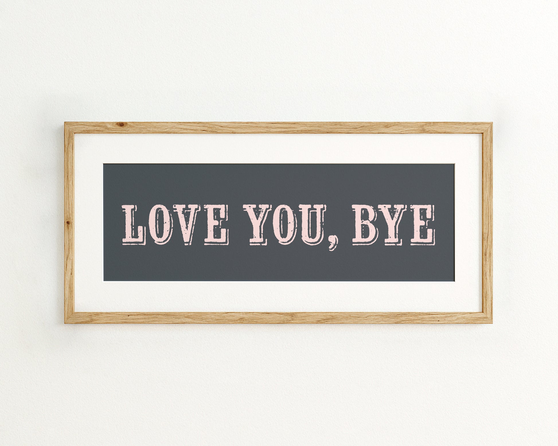 Framed artwork with 'LOVE YOU, BYE' text on a dark blue background