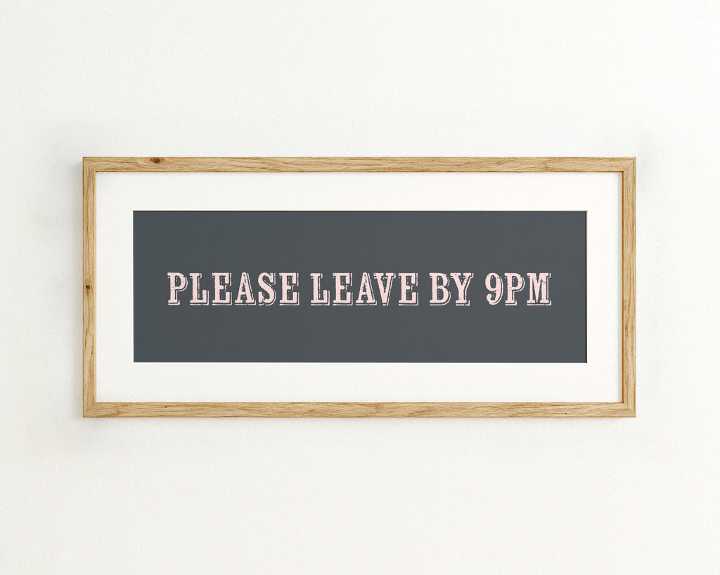 Framed sign with 'PLEASE LEAVE BY 9PM' text on a dark blue background