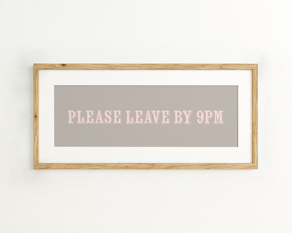Framed sign with 'PLEASE LEAVE BY 9PM' text on a grey background