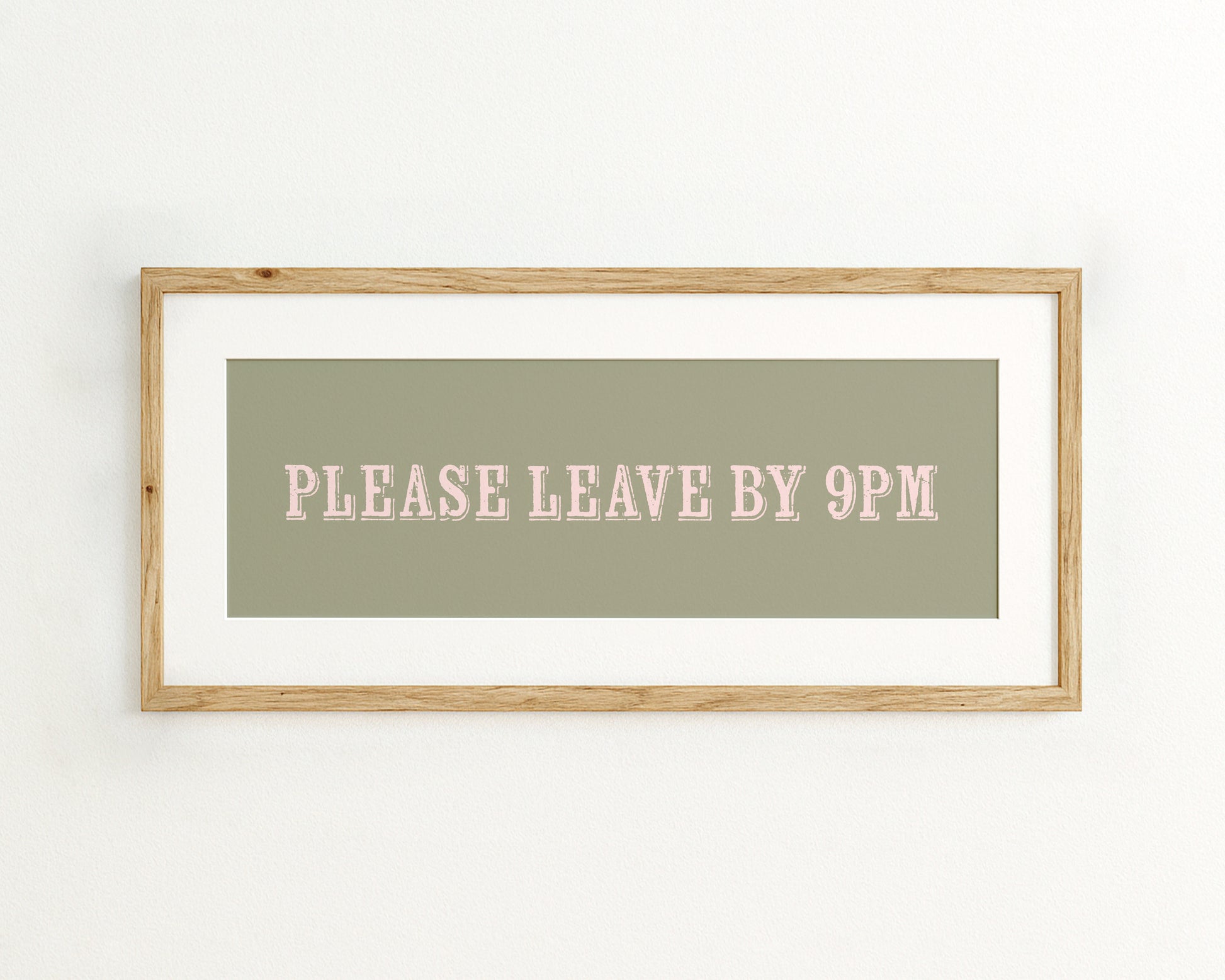 Framed sign with 'PLEASE LEAVE BY 9PM' text on a green background