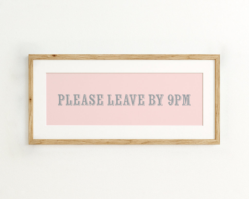 Framed sign with 'PLEASE LEAVE BY 9PM' text on a pink background