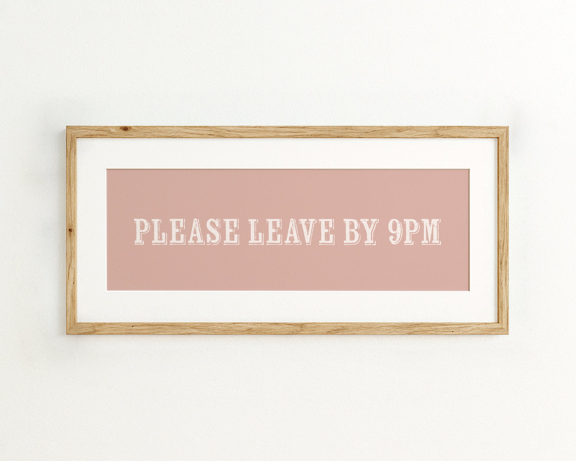 Framed quote 'Please Leave By 9PM' on a pink background