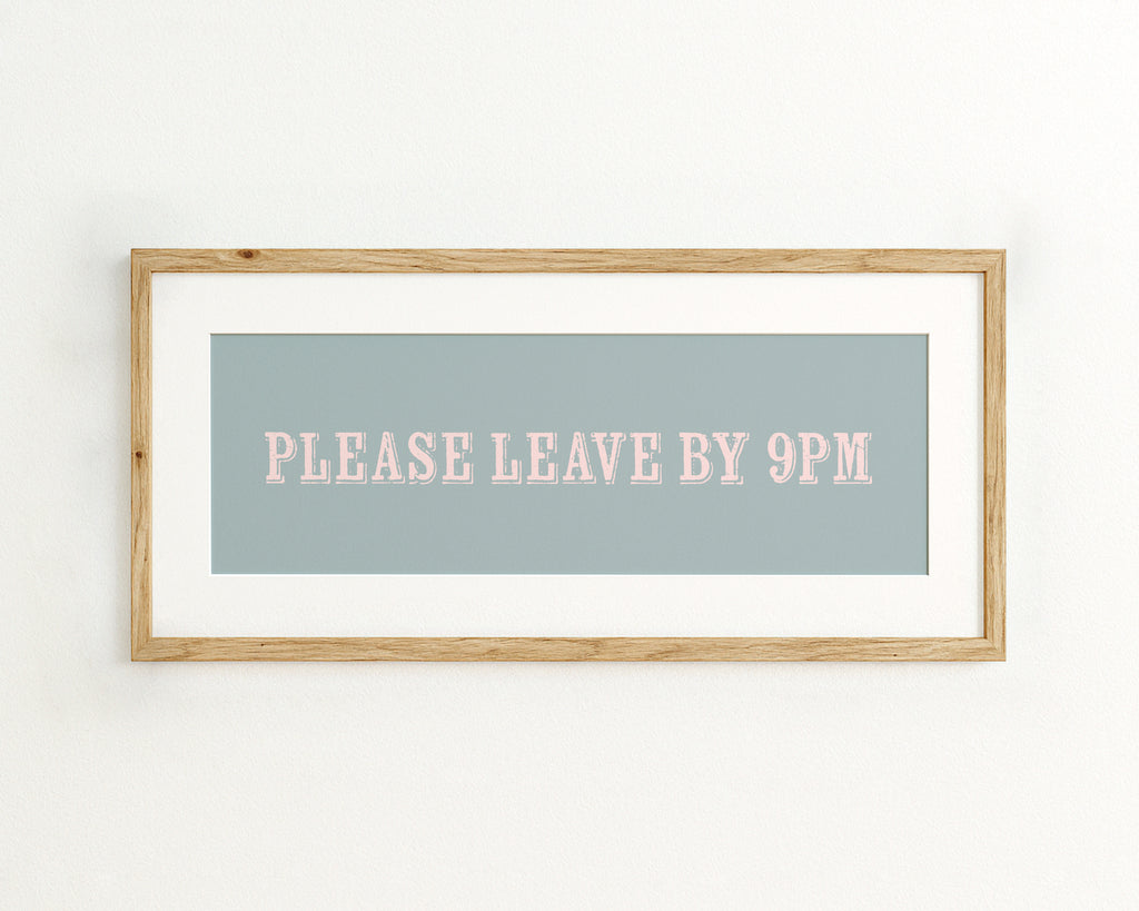 Framed artwork with 'PLEASE LEAVE BY 9PM' text on a light blue background