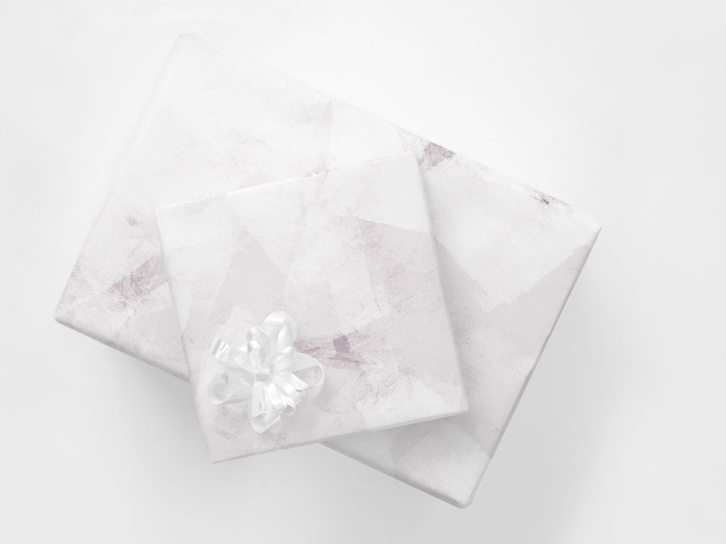 Stacked presents with soft pink abstract gift wrapping