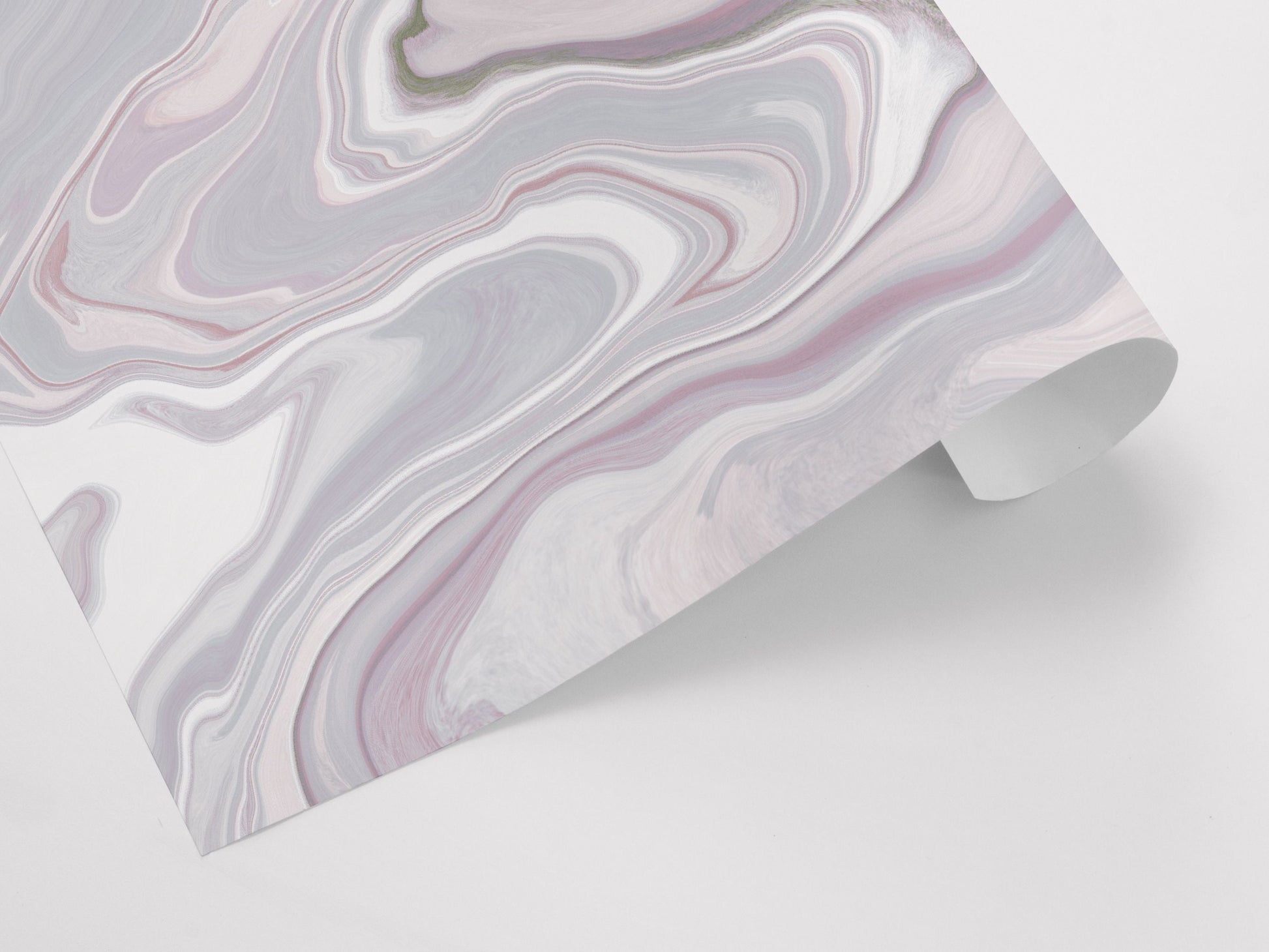 A gift wrap sheet with an abstract marble pattern in pink tones.