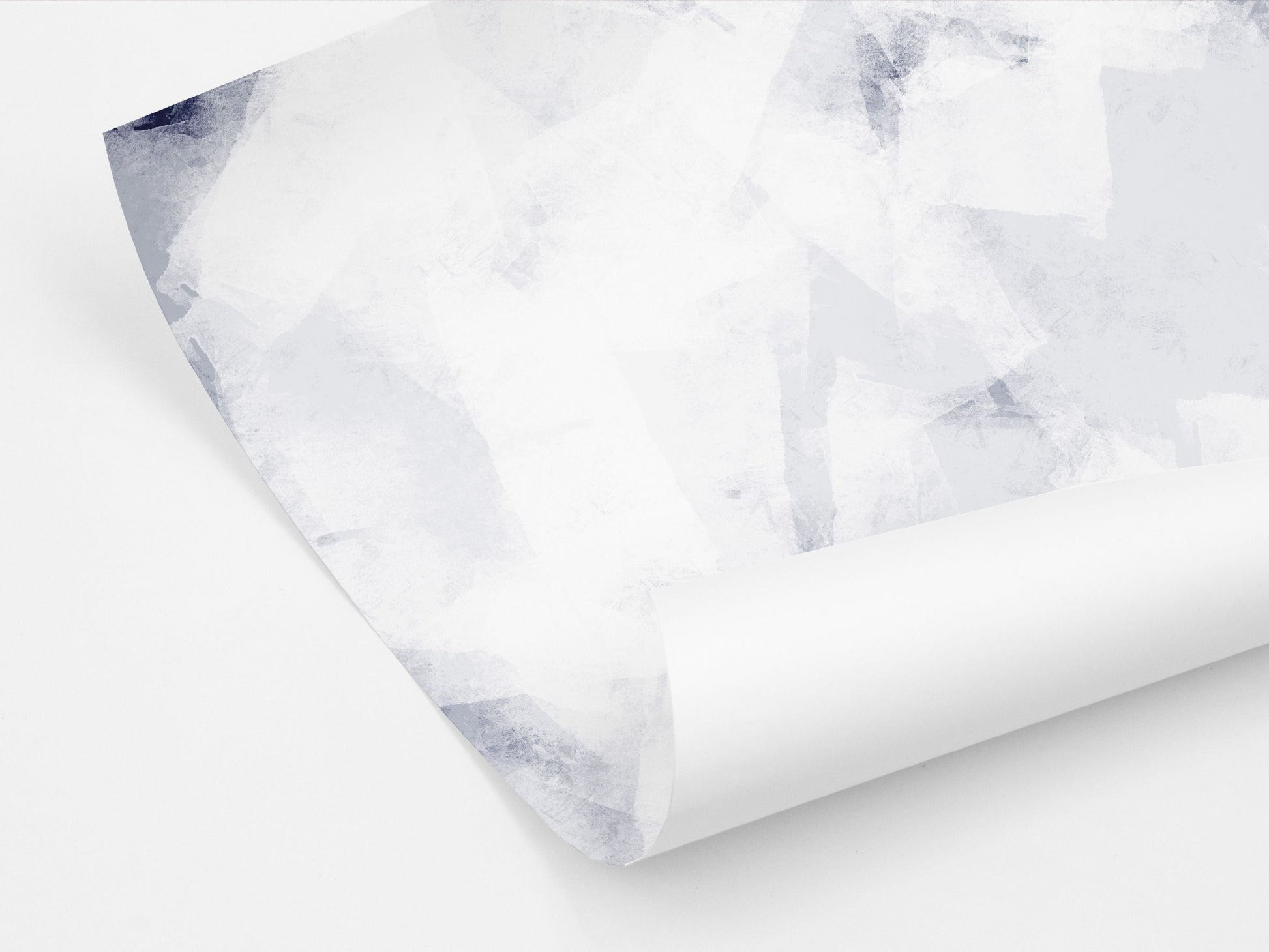 A gift wrap sheet with an abstract geometric pattern in blue and white tones.
