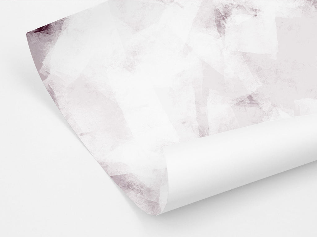 A sheet of gift wrapping paper in soft pink tones with a contemporary abstract design