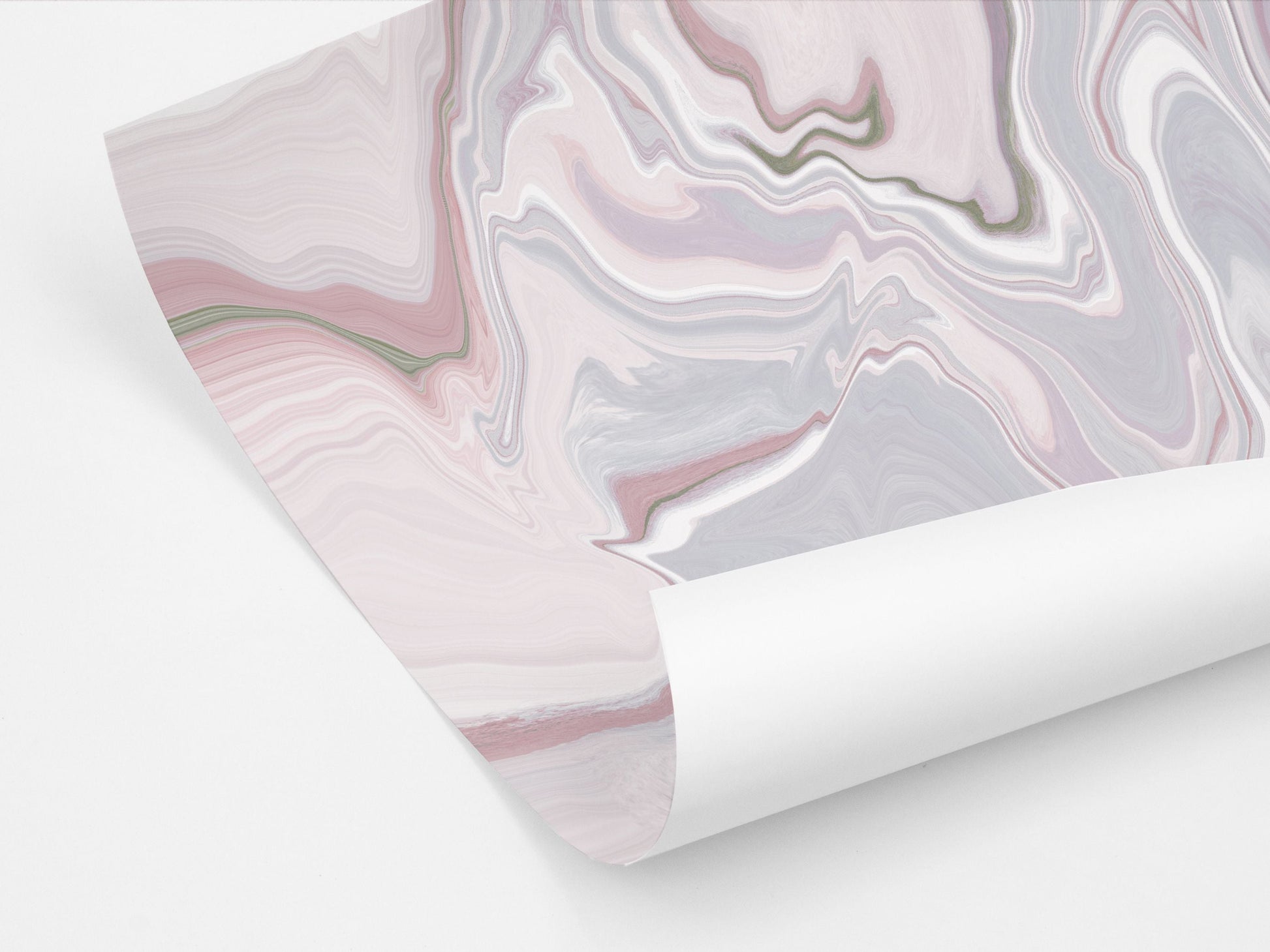 A partially unrolled sheet of wrapping paper featuring a pink toned abstract marble design